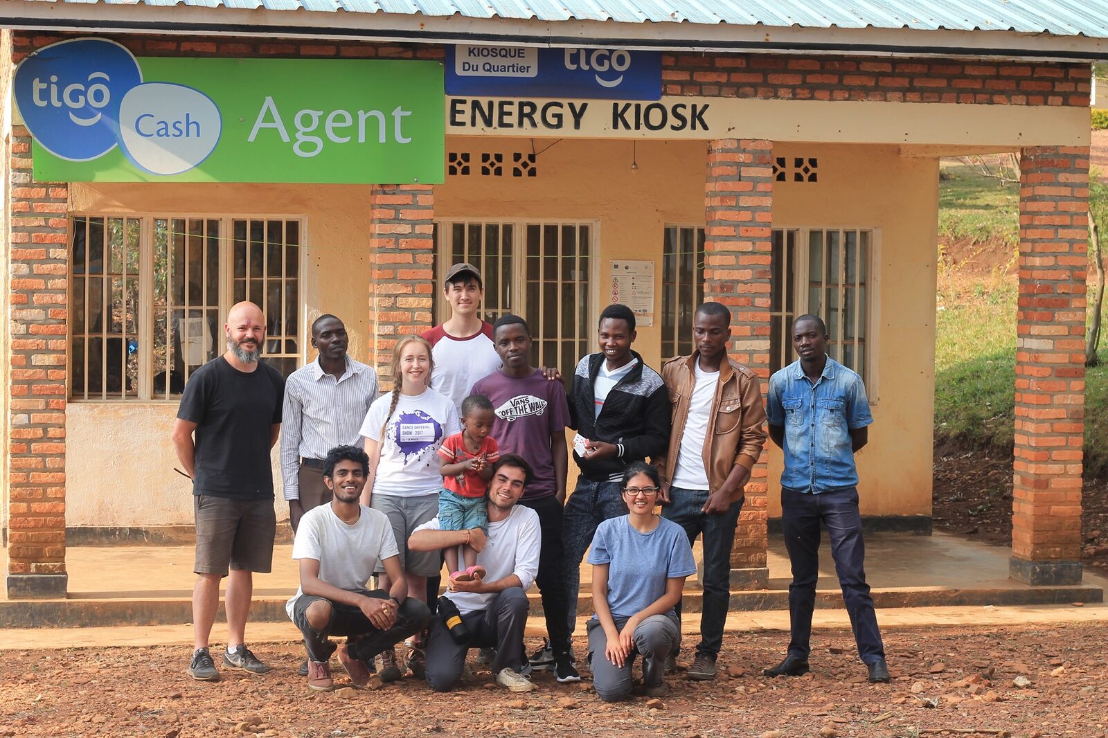 e.quinox students and Rwandan partners outside an Energy Kiosk